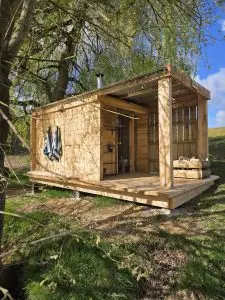 Wood-fired sauna at Leys Farm beside the woodland lake